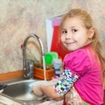 bigstock Small Girl In The Kitchen Wash 56939855 | Stay at Home Mum.com.au