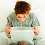 bigstock Young Boy Sitting In Bed Vomit 170723258 | Stay at Home Mum.com.au