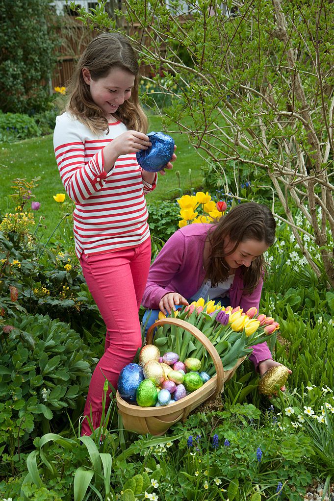 easter egg hunt young girls with chocolate eggs and spring news photo 629556055 1551737717 | Stay at Home Mum.com.au