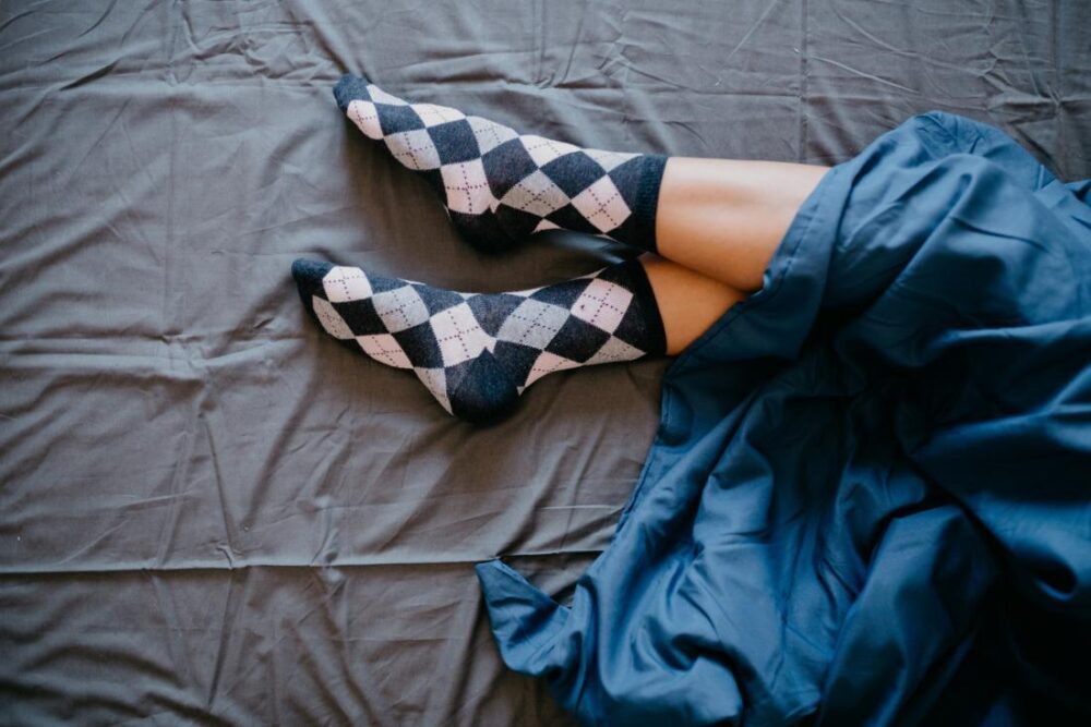 Do You Wear Socks To Bed? This Sleep Hack Might Make You Cringe