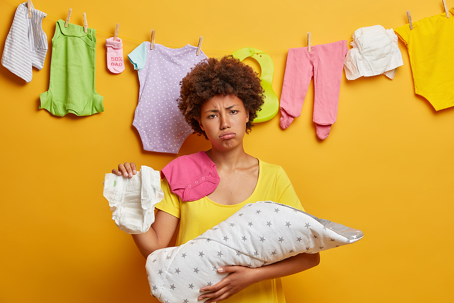 bigstock Sad Upset Mother Changes Nappy 394012694 | Stay at Home Mum.com.au