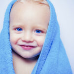 bigstock Little Baby Smiling Under A Wh 354703046 | Stay at Home Mum.com.au