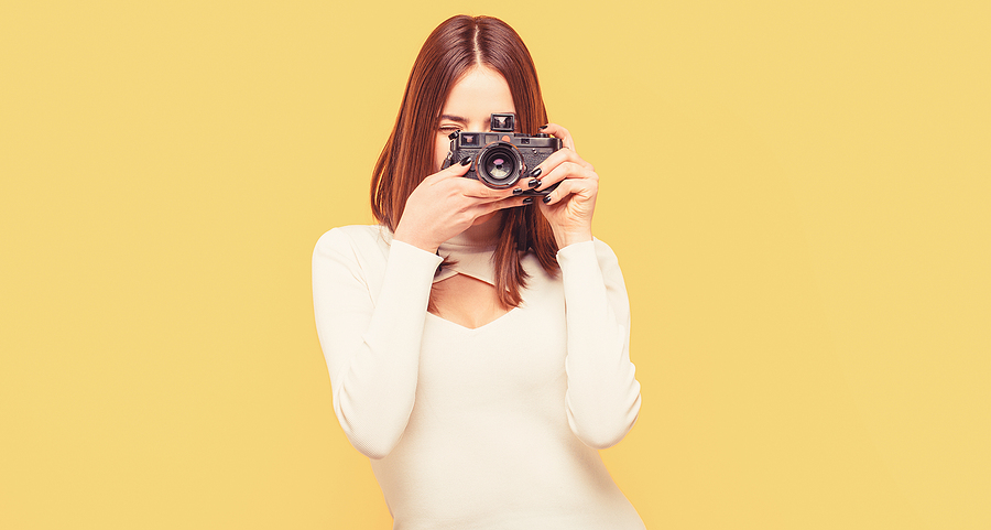 bigstock Woman Holding Camera Over Yell 454764765 | Stay at Home Mum.com.au